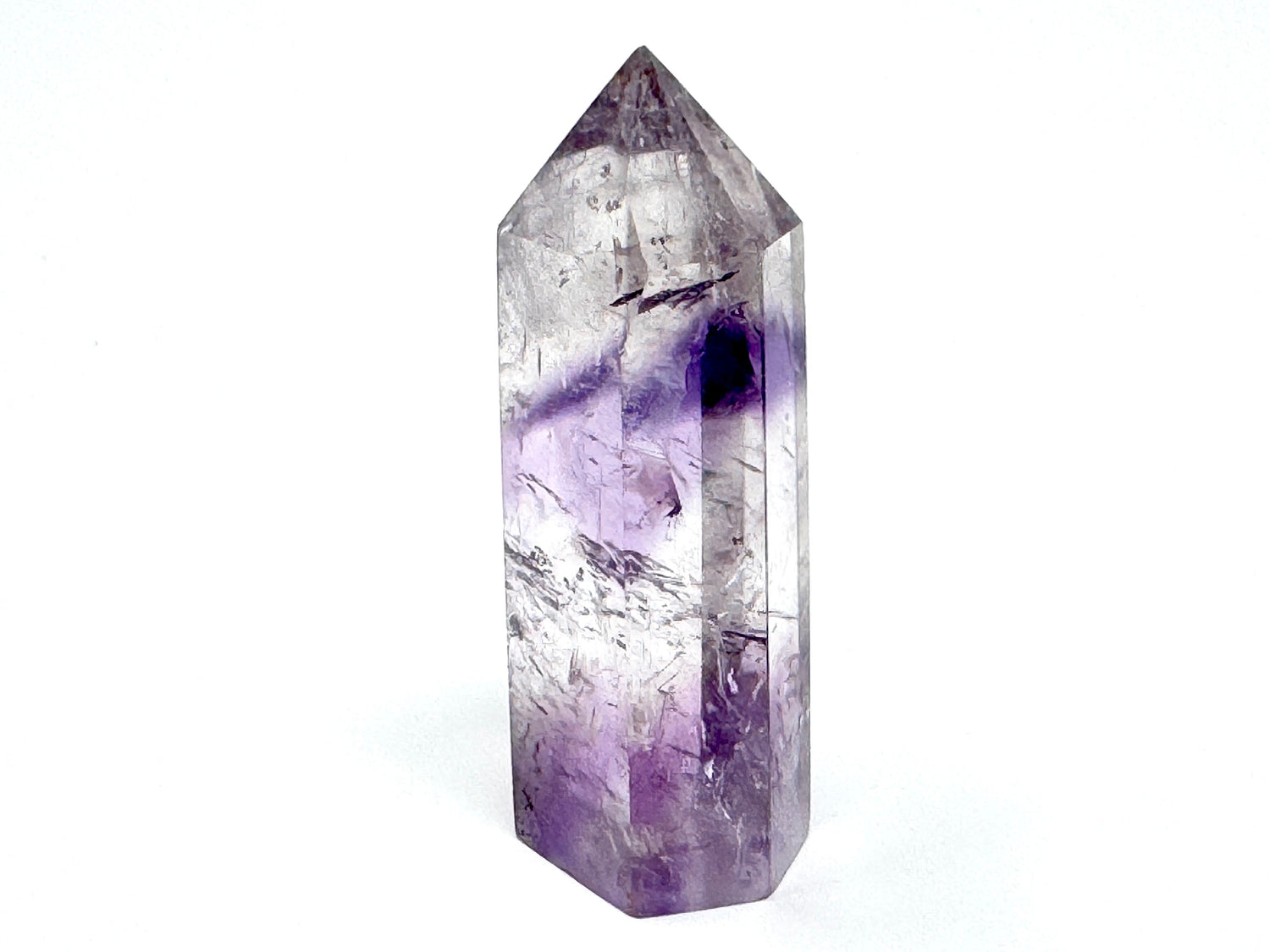 Amethyst Phantom Quartz Point: a free-standing crystal point, single-terminated, showing polished Clear Quartz crystal and purple Amethyst phantom inclusions