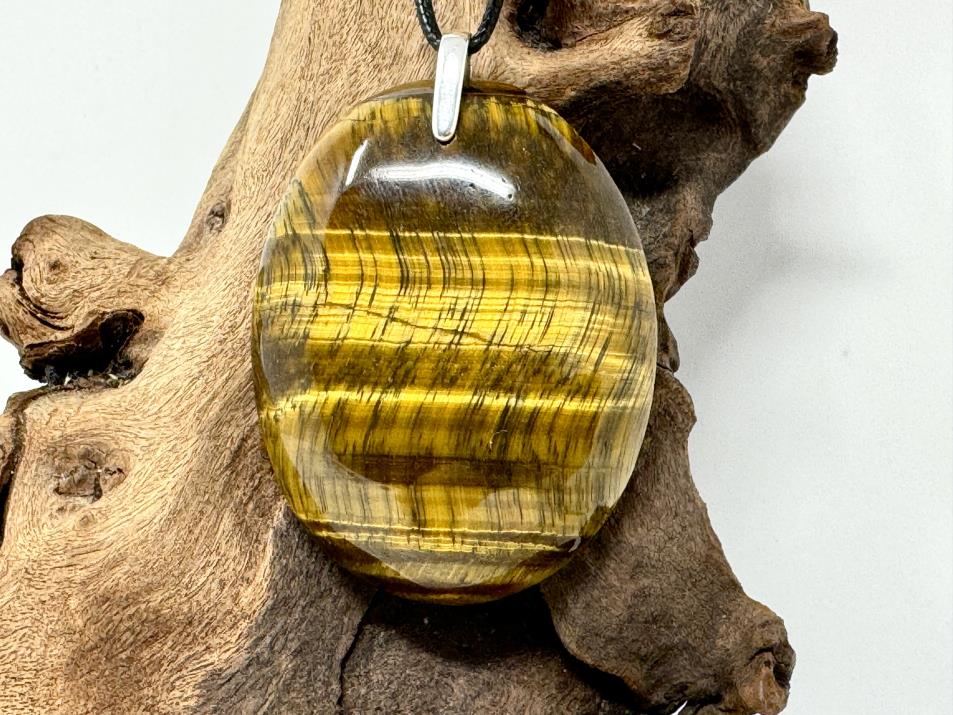 Flashy Gold Tiger's Eye Pendant Crystal Jewellery In Oval Pendant Shape With Chatoyant Cat's Eye Effect And Gold Stripes, Drilled With A Stamped 925 Silver Bail