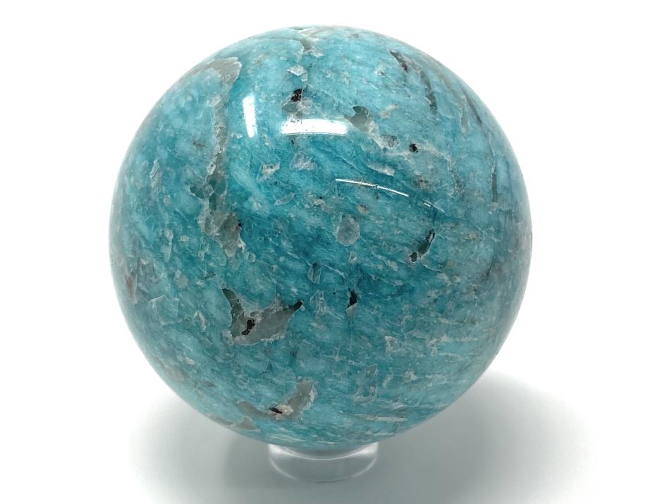 Blue Amazonite crystal sphere with grey Smoky Quartz inclusions, displayed on clear plastic sphere stand