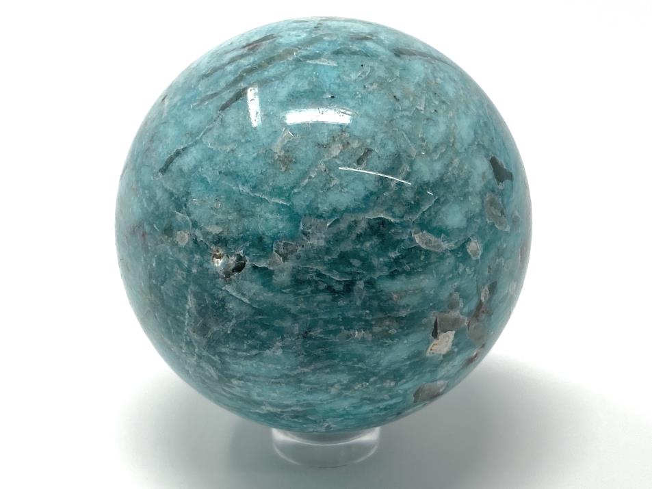 Blue Amazonite crystal sphere with grey Smoky Quartz inclusions, displayed on clear plastic sphere stand