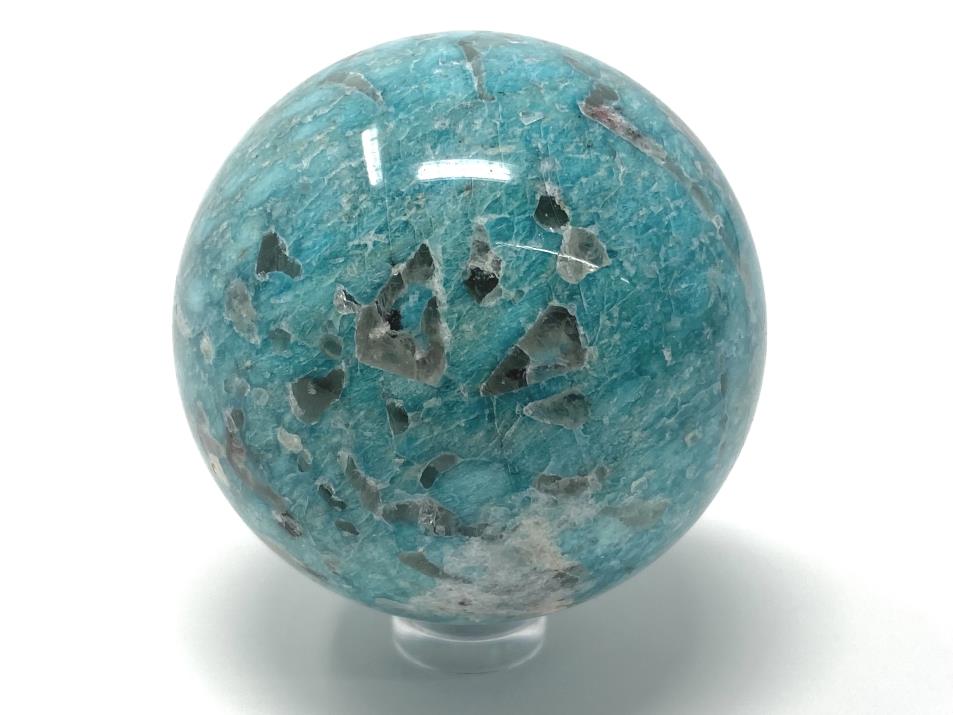 Blue Amazonite crystal sphere with grey Smoky Quartz inclusions, displayed on clear plastic sphere stand