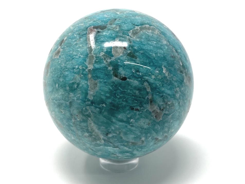 Blue Amazonite crystal sphere with grey Smoky Quartz inclusions, displayed on clear plastic sphere stand